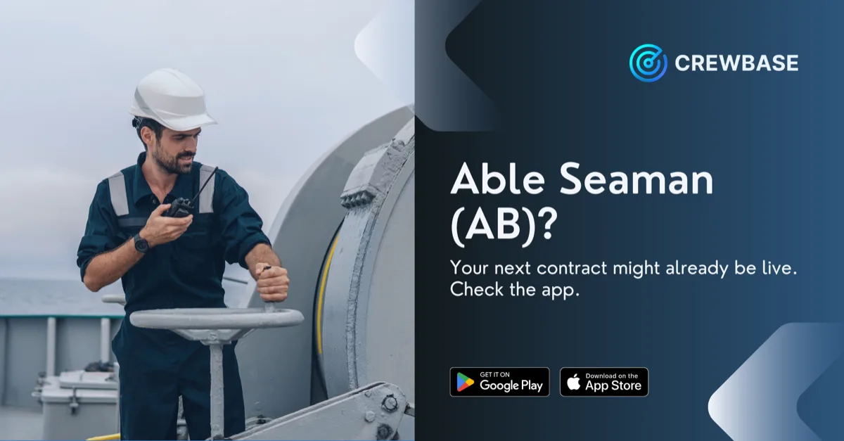 Able seaman in hard hat and coveralls operating ship winch with CrewBase AB recruitment text