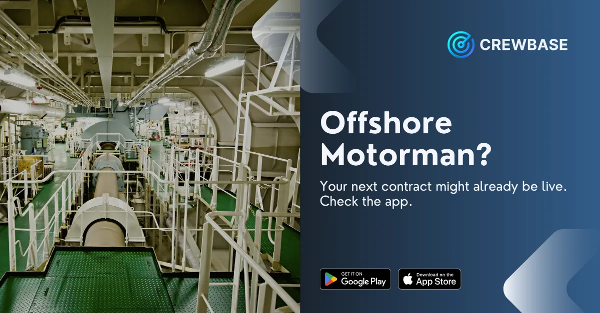 Ship engine room machinery space with CrewBase offshore motorman recruitment banner