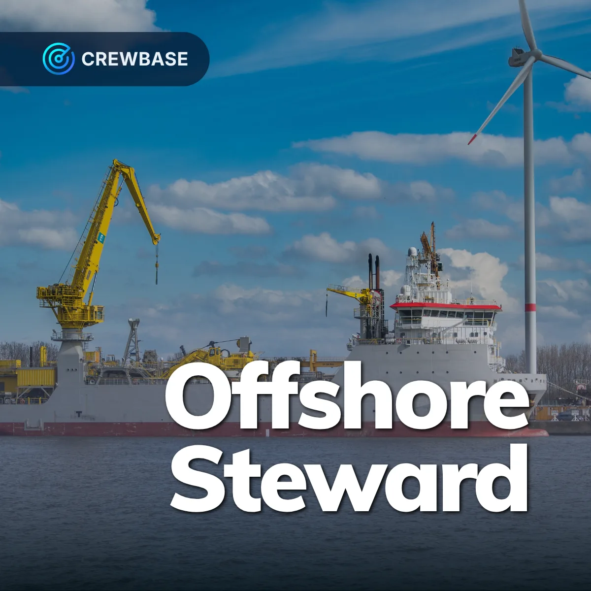 Offshore construction vessel with yellow crane beside wind turbine and CrewBase Offshore Steward text