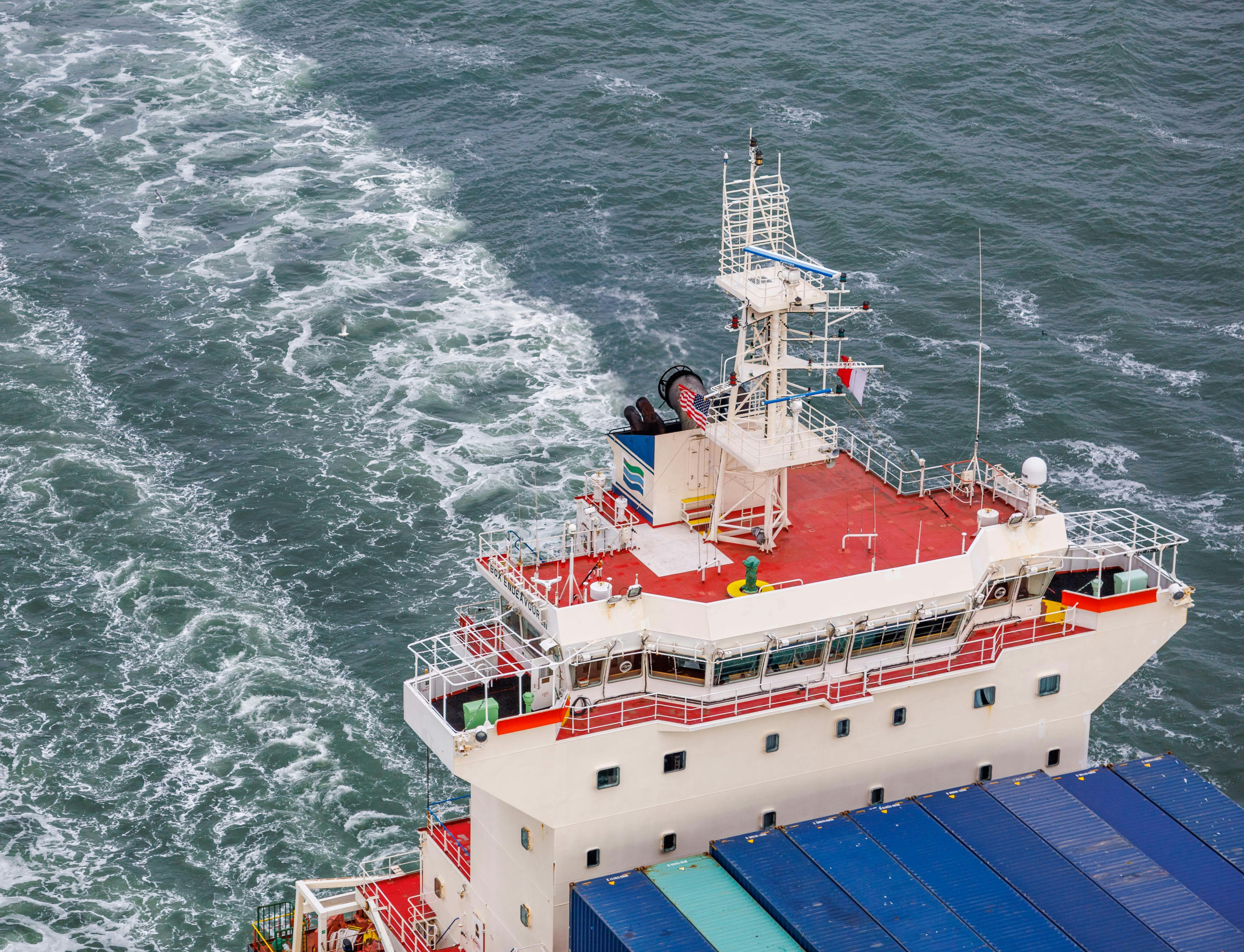 Aerial view of a container vessel bridge and superstructure at sea